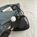 Portable glossy black travel toiletry bag with soft white fur ball pendant detail - With Pendant / Black