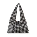 Minimalist black and white gingham tote bag with stylish bow tie closure on white background - Black