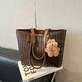 Dark brown woven leather tote bag with a cute plush puppy pendant accessory - With Pendant / Brown