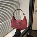 Pink suede hobo shoulder bag with silver M logo and adjustable brown strap detail - Rose Pink