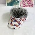 Detail view of novel grey wig visor cap with patriotic American flag print brim - Adult Size (Adjustable) / Gray Synthetic Hair