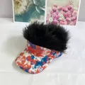 Close-up of funny wig baseball cap with red, white, and blue tie-dye pattern and black fluffy hair - Adult Size (Adjustable) / Black Synthetic Hair