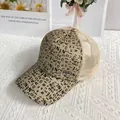 Detail of glitter baseball cap featuring metallic JEANS logo and breathable mesh back - Adult (56-60cm Adjustable) / Gold