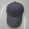 Dark grey baseball cap with a brown leather patch and structured six-panel design - Dark Gray