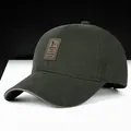 Dark green cotton baseball cap with leather logo patch and brown trim accents - Army Green