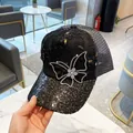 Women's black rhinestone butterfly trucker hat with breathable mesh and lace details - Adult Adjustable / Black