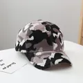 Detail of winter camouflage knit baseball cap showing thick texture and curved brim - Adult Size (Adjustable) / Gray
