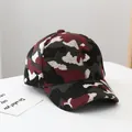 Macro detail of camouflage knit texture and curved brim of this warm winter baseball cap - Adult Size (Adjustable) / Army Green