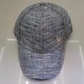 Black and white tweed baseball cap with gold chain trim and metallic M logo - Black