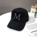 Detail of black wool-blend baseball cap featuring a sparkling rhinestone M initial - Adult Size (56-60cm) / Rick Morty McDonald Black