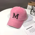 Detail of pink faux fur baseball cap with sequined letter M on a white table - Adult Size (56-60cm) / Pink Letter M