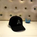 Detail of black mohair baseball cap featuring a sparkling silver rhinestone letter A - Adult Size (56-60cm) / A Black