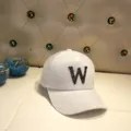 Detailed view of white faux fur baseball cap featuring a sparkling diamond letter W logo - Adult Size (56-60cm) / Letter W / White