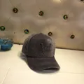Detail of grey plush baseball cap featuring a black sequined letter W and soft fuzzy texture - Adult Size (56-60cm) / Letter W / Gray