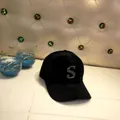 Detail of black faux mink fur baseball cap featuring a sparkling rhinestone letter S - Adult Size (56-60cm) / Letter S / Black