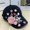 Close-up of black plush baseball cap with 3D floral accents and pearl details - Lace Large Flower Style / Black
