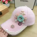 Detail of pink plush baseball cap with 3D fabric flowers, rhinestones, and pearls - Pearl Flower Style / Pink