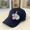 Detail of dark blue baseball cap featuring 3D fabric flowers and a white deer charm - Adult Size (Adjustable) / 3D Floral Deer Decoration / Black