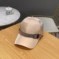 Detailed view of champagne satin baseball cap featuring rhinestone buckle on wood table - Adult Size (Adjustable) / Pink