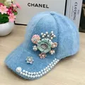 Light blue fuzzy baseball cap with floral accents and faux pearls in plush fabric - Pearl Flower Style / Blue