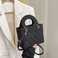 Quilted black handbag with golden hardware and adjustable strap for elegant styling - Black without Pendant