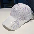 Detailed view of white knitted baseball cap with sparkling colorful rhinestone patterns - One Size(Adjustable) / White