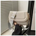 Minimalist beige suede crossbody saddle bag with wide shoulder strap and gold hardware - Suede White