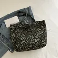Light blue leopard print canvas tote bag with large front pocket and shoulder strap - Leopard Print (Green)