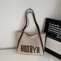 Minimalist cream canvas tote bag with brown leather straps and HOORYA logo print - Brown