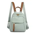 Mochila minimalista de tela Oxford verde menta con elegantes detalles en cuero marrón - Verde