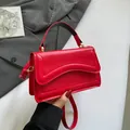 French style bright red crossbody handbag with unique wave stitch details and golden hardware - Red