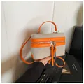 Fashionable contrast stitching box vanity handbag with orange leather trim and long tassels - Orange