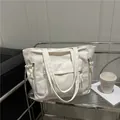 Chic cream nylon tote bag with drawstring side pockets and wide handles for commute - White