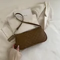 Vintage brown underarm baguette bag for women with chic M-monogram print and shoulder strap - Brown