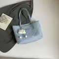 Sky blue quilted tote bag with floral embroidery and white plush cloud charm accessory - With Pendant / Blue