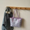 Purple jacquard tote bag with geometric floral patterns and purple leather handles - Violet