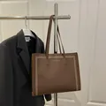 Brown lychee leather tote bag with white polka dot border and large capacity for daily commute - Brown