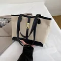 Beige canvas tote bag with black leather patchwork and golden twist lock for women - Black