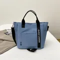 Hellblaue Lunchtasche aus Segeltuch mit Griffen und EVES CAMIER Druck für Büro oder Schule - Blau