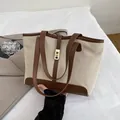 Beige canvas tote bag with brown leather trim and golden square metal buckle - Brown