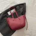 Red lychee pattern leather tote bag with contrast stitching and long shoulder straps - Red