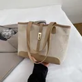 Beige canvas and brown leather patchwork tote bag with gold metal clasp detail - Khaki