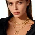Three-layer gold layered necklace featuring a flat snake chain and a toggle clasp pendant - Gold