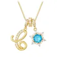 Macro detail of gold letter C pendant with sunburst blue stone on box chain - Letter C Style / Gold
