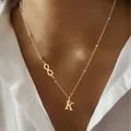 Gold infinity charm necklace featuring small beads and a capital letter K pendant - Letter A / Gold