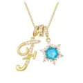 Golden necklace featuring a zircon-studded letter F and a blue snowflake pendant - Letter F Style / Gold
