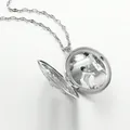 Macro detail of silver oval locket necklace showing intricate hollow pattern and photo inside - Silver Oval Hollow Style (A#)
