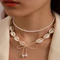 Double-layered Hawaiian beach shell necklace with white pearls and a bow knot accent - Beige Wax Rope
