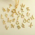 Close-up of golden paperclip chain with 26 alphabets OT buckle pendants on leather - Letter A / Gold