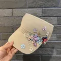 Detail of handmade floral appliques with pearls on a woven sun visor hat - Adult Size (Adjustable) / Khaki